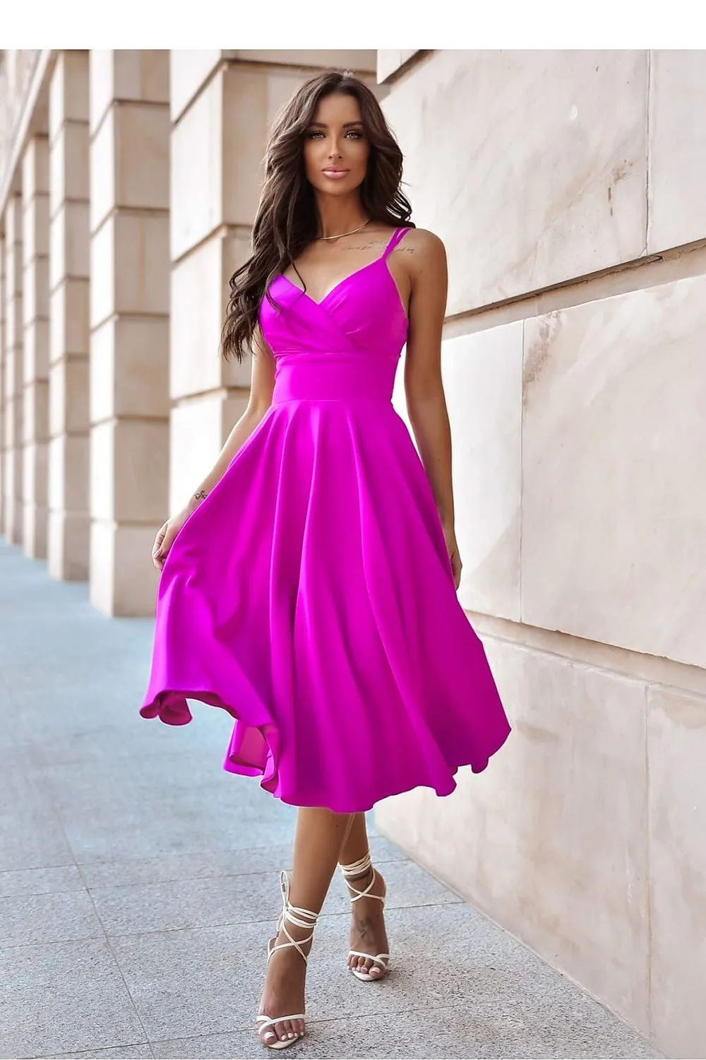 Flared bottom evening dress with a long slit